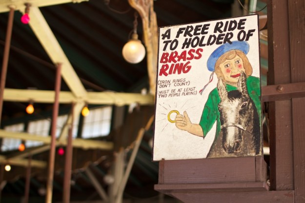 a sign advertising the brass ring game